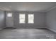 Living room featuring neutral paint, white trim, and vinyl plank flooring throughout at 35494 Dry Rd, Albemarle, NC 28001