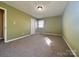 Spacious carpeted bedroom with a closet and natural light showcases a blank canvas ready for personalization at 3660 9Th Street Ne Dr, Hickory, NC 28601