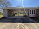 Spacious carport with concrete flooring and brick pillars to provide ample parking at 3660 9Th Street Ne Dr, Hickory, NC 28601