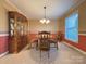 Charming dining room with classic china cabinet, round table, and chandelier at 3660 9Th Street Ne Dr, Hickory, NC 28601