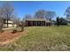 Lovely brick home with welcoming front porch, set amidst a lush green lawn at 3660 9Th Street Ne Dr, Hickory, NC 28601