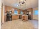 Well-equipped kitchen featuring stainless steel appliances, an island, and oak cabinets at 3660 9Th Street Ne Dr, Hickory, NC 28601