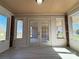 Bright sun room featuring many windows with double doors, and neutral tile flooring at 3660 9Th Street Ne Dr, Hickory, NC 28601