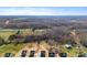 Distant aerial view of new construction homes with trees, fields and partially cloudy skies at 4005 Miller Rd, Salisbury, NC 28147