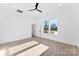 A bright bedroom with wood-look floors, ample natural light from backyard view at 4005 Miller Rd, Salisbury, NC 28147