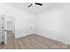 Bright bedroom features light wood floors, ceiling fan and double door closet at 4005 Miller Rd, Salisbury, NC 28147