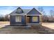 Craftsman style home with navy blue siding, light trim, and a covered front entry with wood columns at 4005 Miller Rd, Salisbury, NC 28147