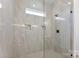 Beautiful walk-in shower featuring attractive tile, glass enclosure, and built in shelving at 4005 Miller Rd, Salisbury, NC 28147