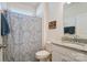 Well-lit bathroom with granite counters and a patterned shower curtain at 4208 Stream Dale Nw Cir, Concord, NC 28027