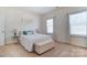 Cozy bedroom featuring soft carpet and ample natural light at 4208 Stream Dale Nw Cir, Concord, NC 28027