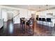 Dining area featuring hardwood floors and an open view of the kitchen at 4208 Stream Dale Nw Cir, Concord, NC 28027