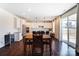 Open concept kitchen and dining area featuring hardwood floors and a kitchen island with bar seating at 4208 Stream Dale Nw Cir, Concord, NC 28027