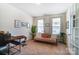 Cozy living room with neutral tones, ample natural light, and comfortable seating at 4208 Stream Dale Nw Cir, Concord, NC 28027