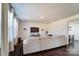 Cozy living room with a plush sectional sofa, hardwood floors, and bright natural light at 4208 Stream Dale Nw Cir, Concord, NC 28027