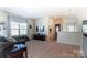 Spacious living room with plush carpet and natural light at 4208 Stream Dale Nw Cir, Concord, NC 28027