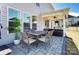 Outdoor patio featuring a table, chairs, and a cozy covered seating area with a ceiling fan at 4208 Stream Dale Nw Cir, Concord, NC 28027