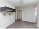 Bedroom features neutral walls and carpet, and reptile habitat shelf at 446 Brannon Meadows Dr, York, SC 29745