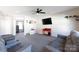 Bright living room with neutral carpet, ceiling fan, and comfortable seating, creating a relaxing atmosphere at 446 Brannon Meadows Dr, York, SC 29745