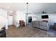 Inviting living area adjacent to the kitchen featuring hardwood floors, a chandelier, and comfortable seating at 446 Brannon Meadows Dr, York, SC 29745