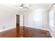 Spacious bedroom with hardwood floors, trim, ceiling fan, and closet at 4717 Doris Ave, Charlotte, NC 28205