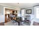 Bright dining room with chandelier and view of open concept kitchen with natural light at 4717 Doris Ave, Charlotte, NC 28205