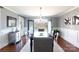 Elegant dining room with chandelier, french doors to patio, and hardwood floors at 4717 Doris Ave, Charlotte, NC 28205