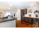 Modern kitchen with stainless steel appliances and dark wood cabinets at 4717 Doris Ave, Charlotte, NC 28205