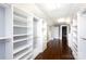 Large walk-in closet with custom shelves and hanging storage, with hardwood floors at 4717 Doris Ave, Charlotte, NC 28205