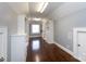 Spacious walk-in closet featuring custom shelving, cabinets and hardwood floors at 4717 Doris Ave, Charlotte, NC 28205