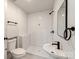 Modern bathroom featuring white subway tiles, black fixtures and a stylish pedestal sink at 507 N Oakland St, Gastonia, NC 28052