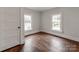 Cozy bedroom boasts hardwood floors and dual windows for natural light at 507 N Oakland St, Gastonia, NC 28052