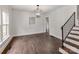 Bright dining room area featuring hardwood floors, contemporary lighting, and a stairway at 507 N Oakland St, Gastonia, NC 28052