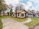 Exterior angle view of a single-Gathering home with a well-maintained yard and driveway at 507 N Oakland St, Gastonia, NC 28052