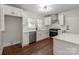 Well-equipped kitchen featuring white cabinets, stainless steel appliances, and ample counter space at 507 N Oakland St, Gastonia, NC 28052