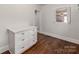 Kitchen area offers white cabinetry, hardwood floors, and ample natural light at 507 N Oakland St, Gastonia, NC 28052