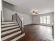 Bright living room with fireplace, hardwood floors, and a stairway at 507 N Oakland St, Gastonia, NC 28052