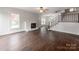 Spacious living room featuring hardwood floors, a cozy fireplace, and plenty of natural light at 507 N Oakland St, Gastonia, NC 28052