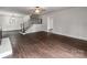 Spacious living room with hardwood floors, modern lighting, and stairway at 507 N Oakland St, Gastonia, NC 28052