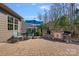 Patio area features an outdoor kitchen, dining area, and manicured backyard at 5136 Samoa Ridge Dr, Lancaster, SC 29720