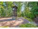 Community clock tower with a brick base, surrounded by lush landscaping and inviting pathways at 5136 Samoa Ridge Dr, Lancaster, SC 29720