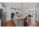 Bright kitchen with white cabinetry, modern appliances, granite countertops, and a center island with seating at 5136 Samoa Ridge Dr, Lancaster, SC 29720