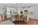 Stylish kitchen with white cabinets, granite countertops, pendant lighting, and a large central island at 5136 Samoa Ridge Dr, Lancaster, SC 29720