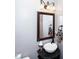 Chic powder room featuring a vessel sink, decorative mirror, and elegant lighting at 625 Circle Trace Rd, Monroe, NC 28110