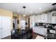 Modern kitchen with gray cabinets, black granite island, and stainless steel appliances at 625 Circle Trace Rd, Monroe, NC 28110