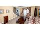 Comfortable living room with decorative furnishings, patterned sofa, and a staircase visible near the home's entrance at 625 Circle Trace Rd, Monroe, NC 28110