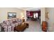 Cozy living room adjacent to dining area, featuring patterned sofa and ornate decor and furnishings at 625 Circle Trace Rd, Monroe, NC 28110