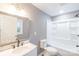 Clean bathroom featuring a sleek vanity with a marble countertop, updated fixtures, and a shower-tub combo at 6282 Richburg Rd, Great Falls, SC 29055