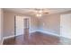 Spacious bedroom with hardwood floors and a doorway offering a view into the rest of the home at 6282 Richburg Rd, Great Falls, SC 29055