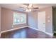 Bedroom features hardwood floors, natural light, and a ceiling fan at 6282 Richburg Rd, Great Falls, SC 29055