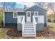 Charming home with blue siding, white trim, and a welcoming entrance with a staircase and railing at 6282 Richburg Rd, Great Falls, SC 29055